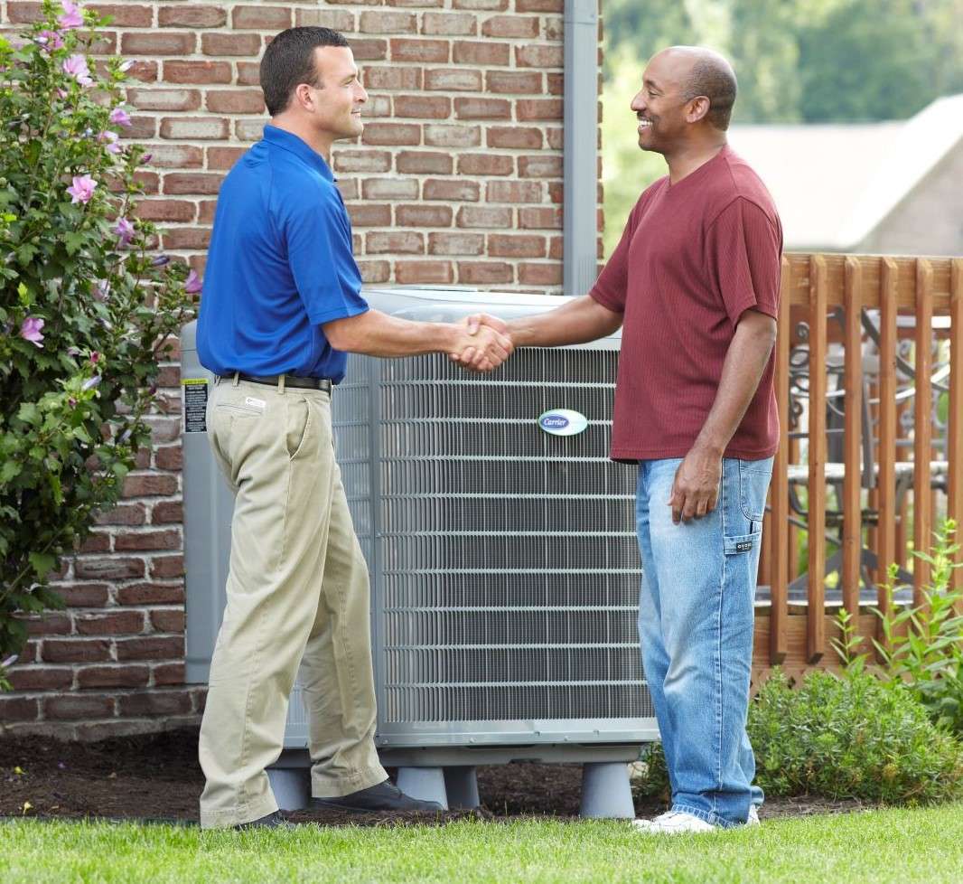 AC Installation - Man meeting with HVAC professional and shaking hands