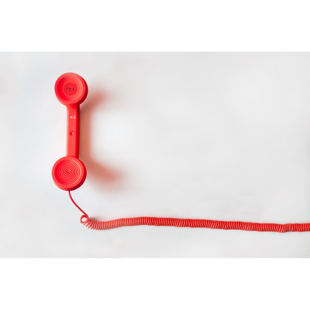 red phone against a white background