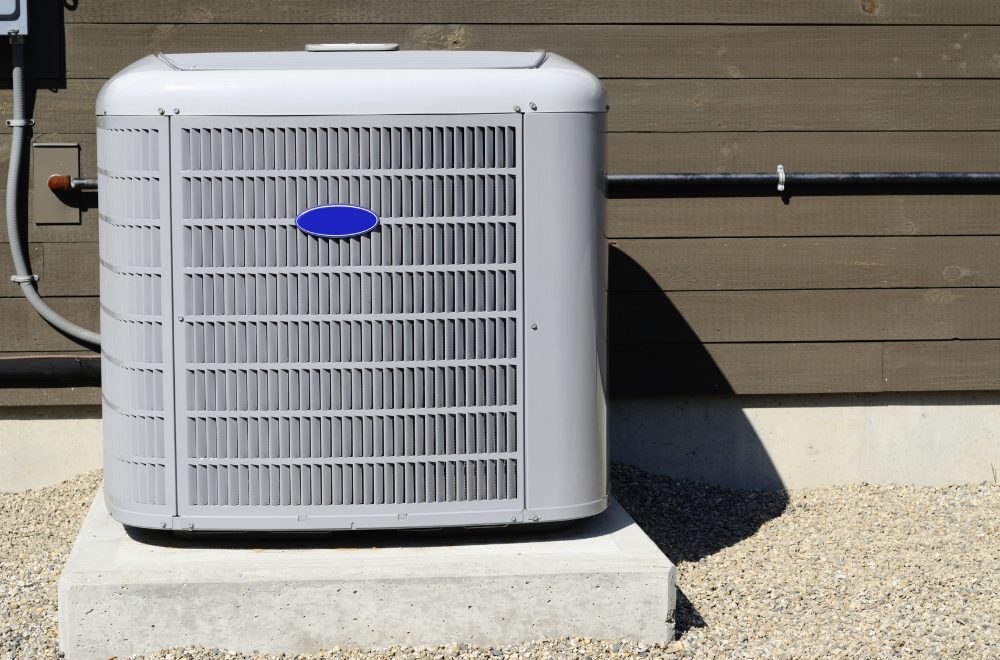 HVAC Maintenance Tips - close up picture of a home HVAC unit