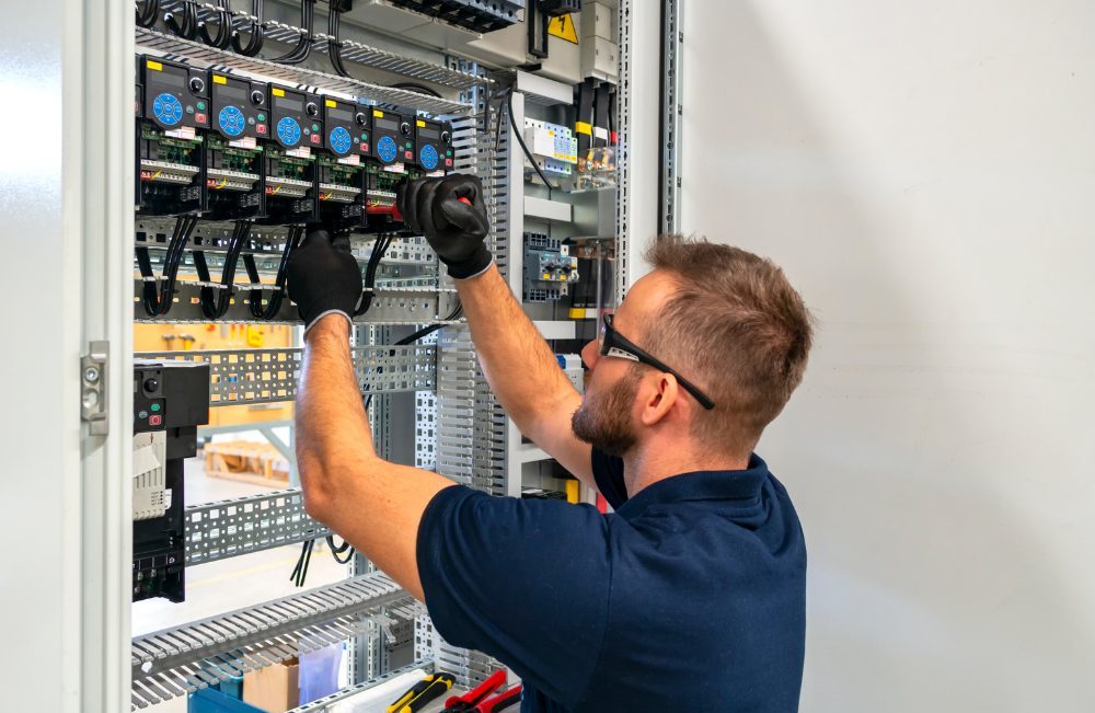 Electrician performing commercial electric service on a breaker